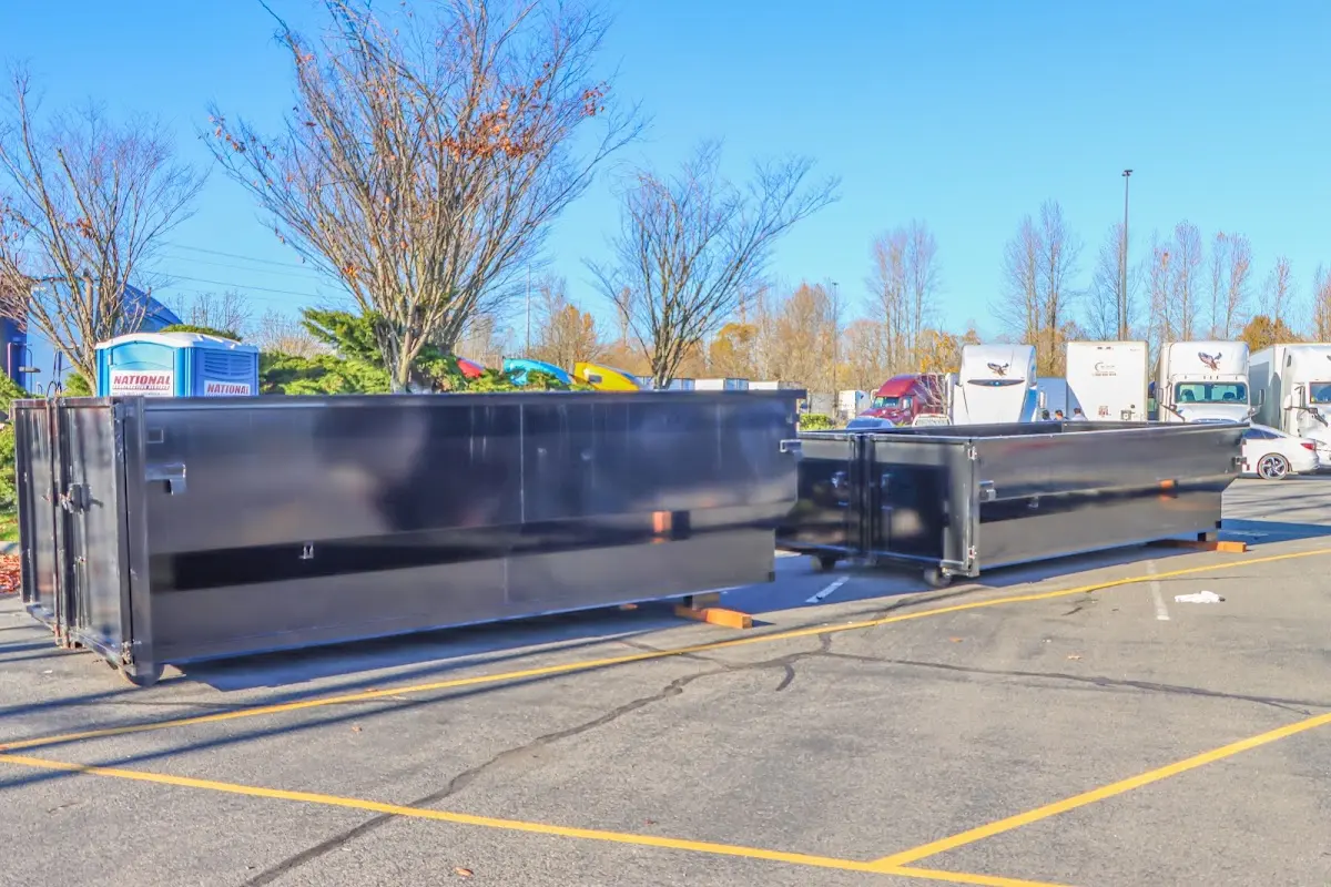 Professional dumpster rental service with roll-off container on residential driveway in Temple Terrace